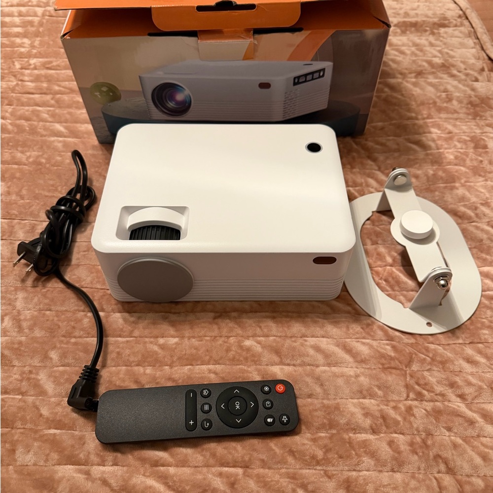 White Mini 4K Portable Projector with Remote and Stand. HDMI cable included.